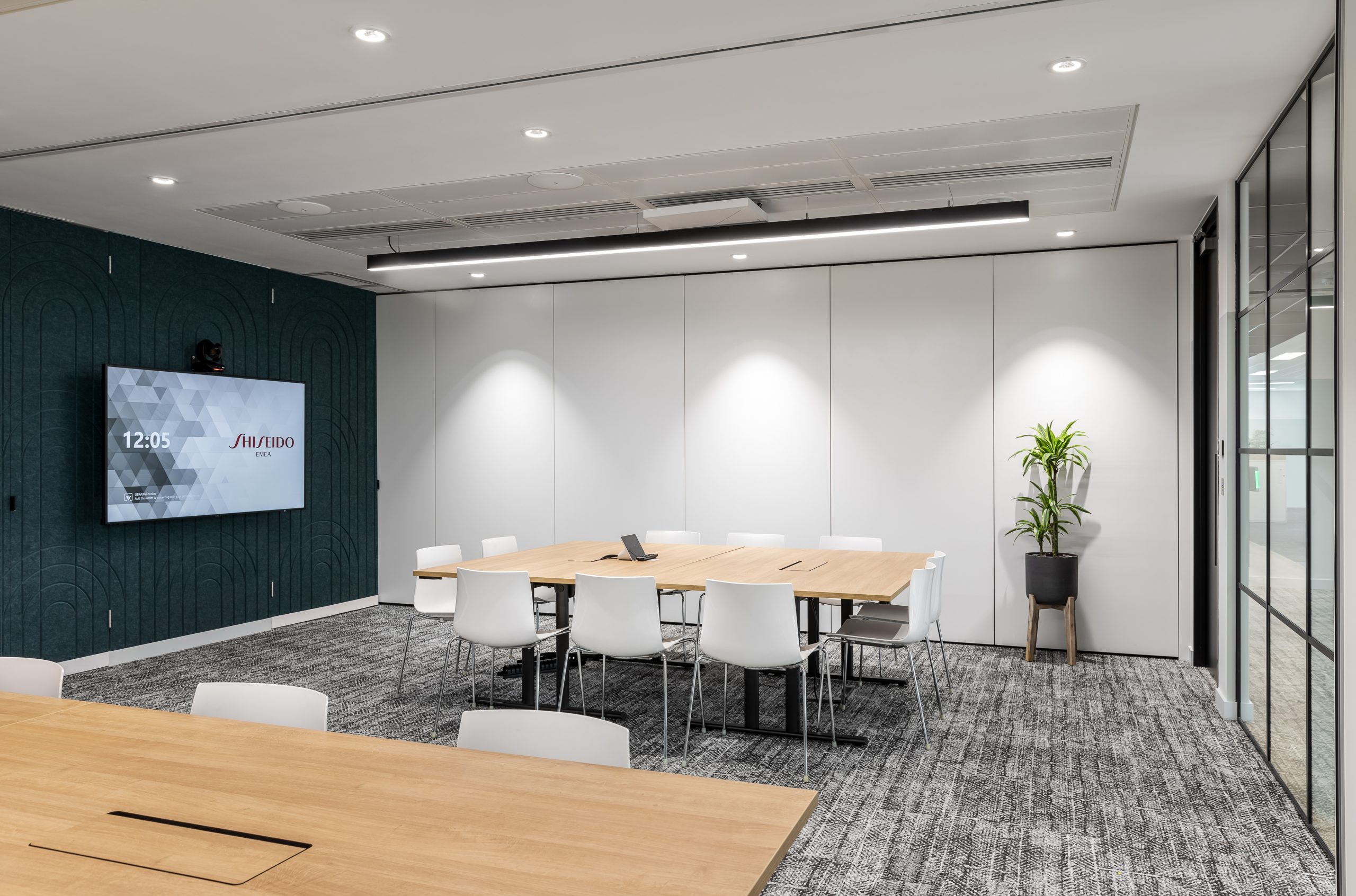 An image showing AV solutions in a meeting room which has been segmented.